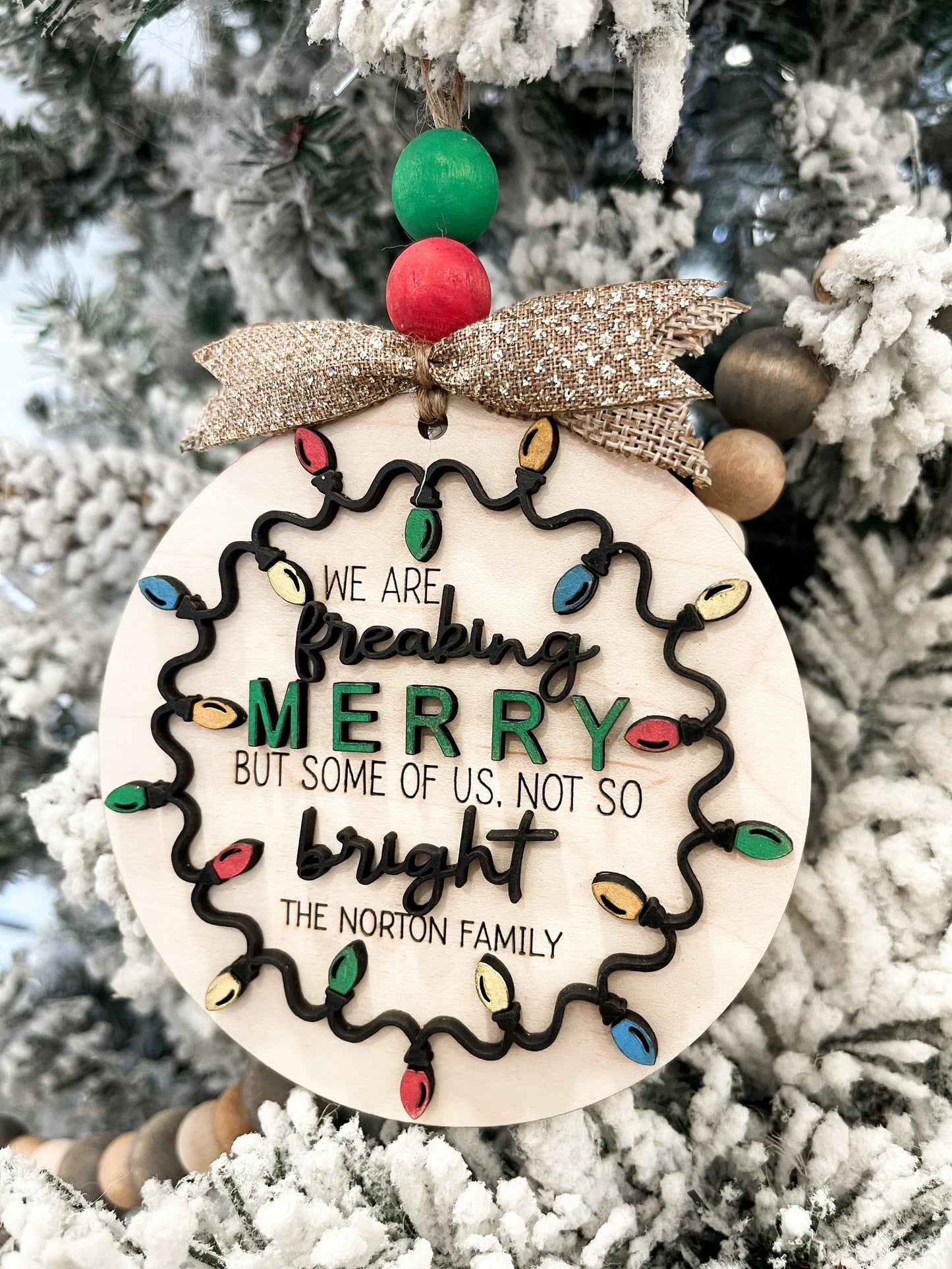 Customizable Family "We Are Freaking Merry But Some Of Us, Not So Bright" Christmas Door Hanger Sign / Ornament Laser Cut File | Glowforge