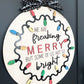 Customizable Family "We Are Freaking Merry But Some Of Us, Not So Bright" Christmas Door Hanger Sign / Ornament Laser Cut File | Glowforge